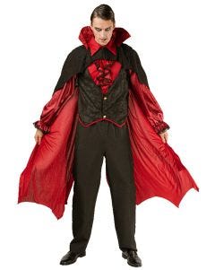 a man dressed in a vampire costume